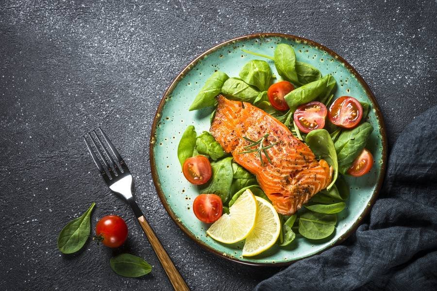 Wild salmon with spinach salad — ideal protein meal for blood sugar support