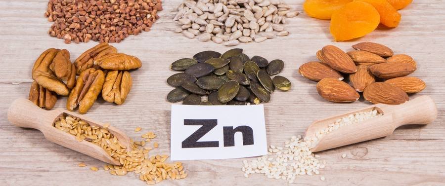 Zinc-rich foods including pumpkin seeds, almonds, pecans and flaxseeds