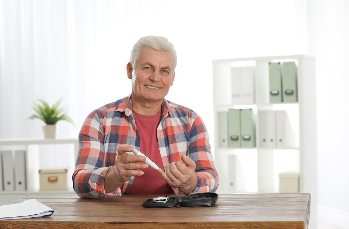 Senior man confidently testing blood sugar levels — knowing the right ingredients makes the difference
