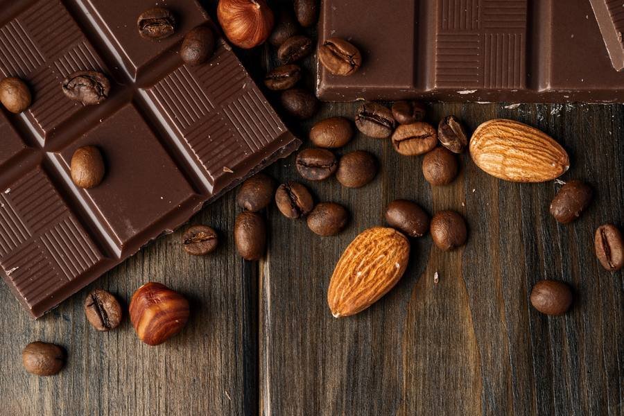 Dark chocolate with almonds and coffee beans — excellent sources of magnesium for blood sugar support