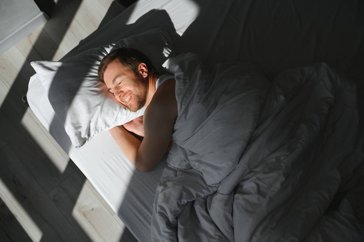 Man sleeping well for optimal health and recovery